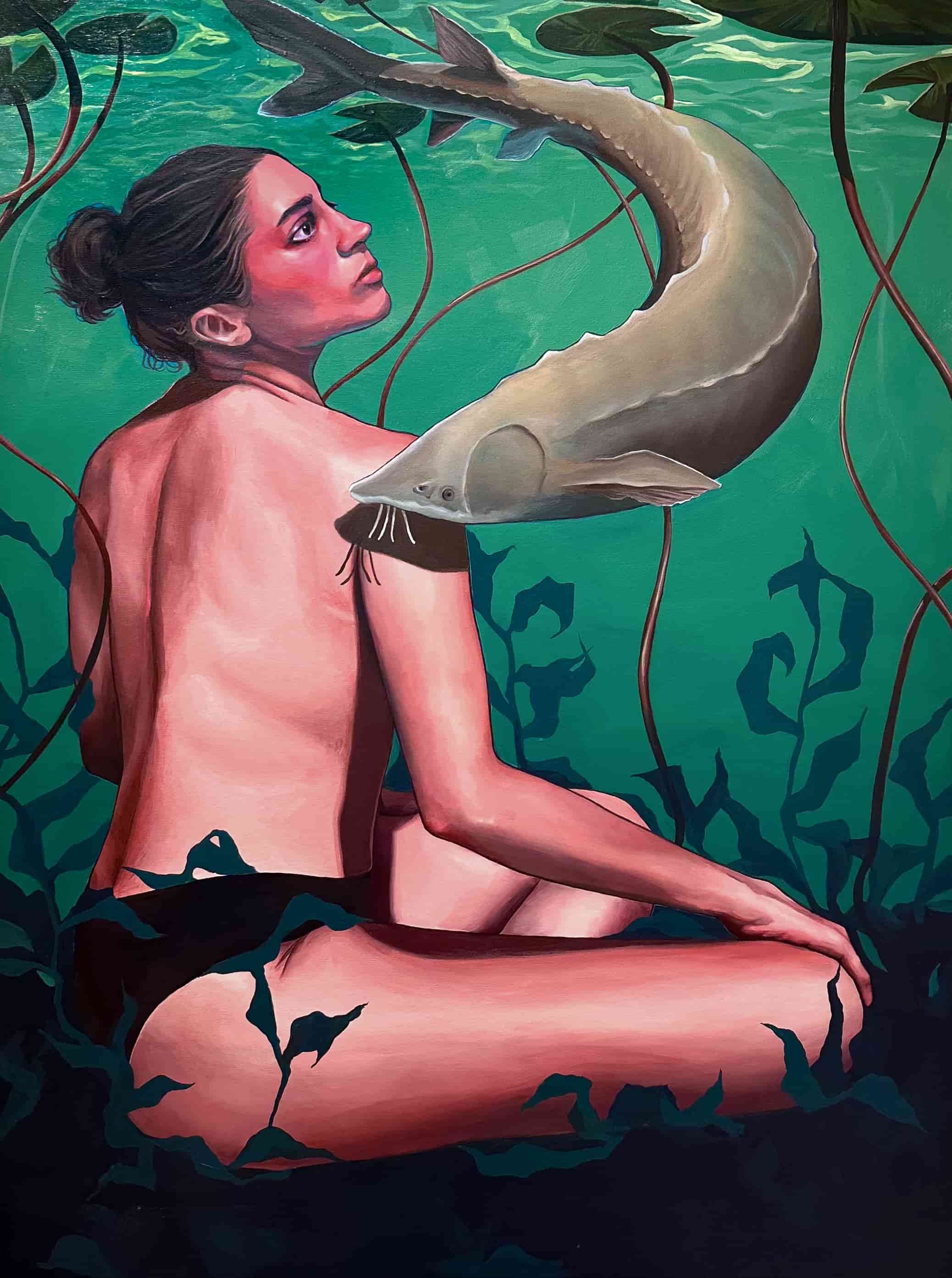 A portrait of a woman, sitting on the floor of a pond with a sturgeon swimming above her.