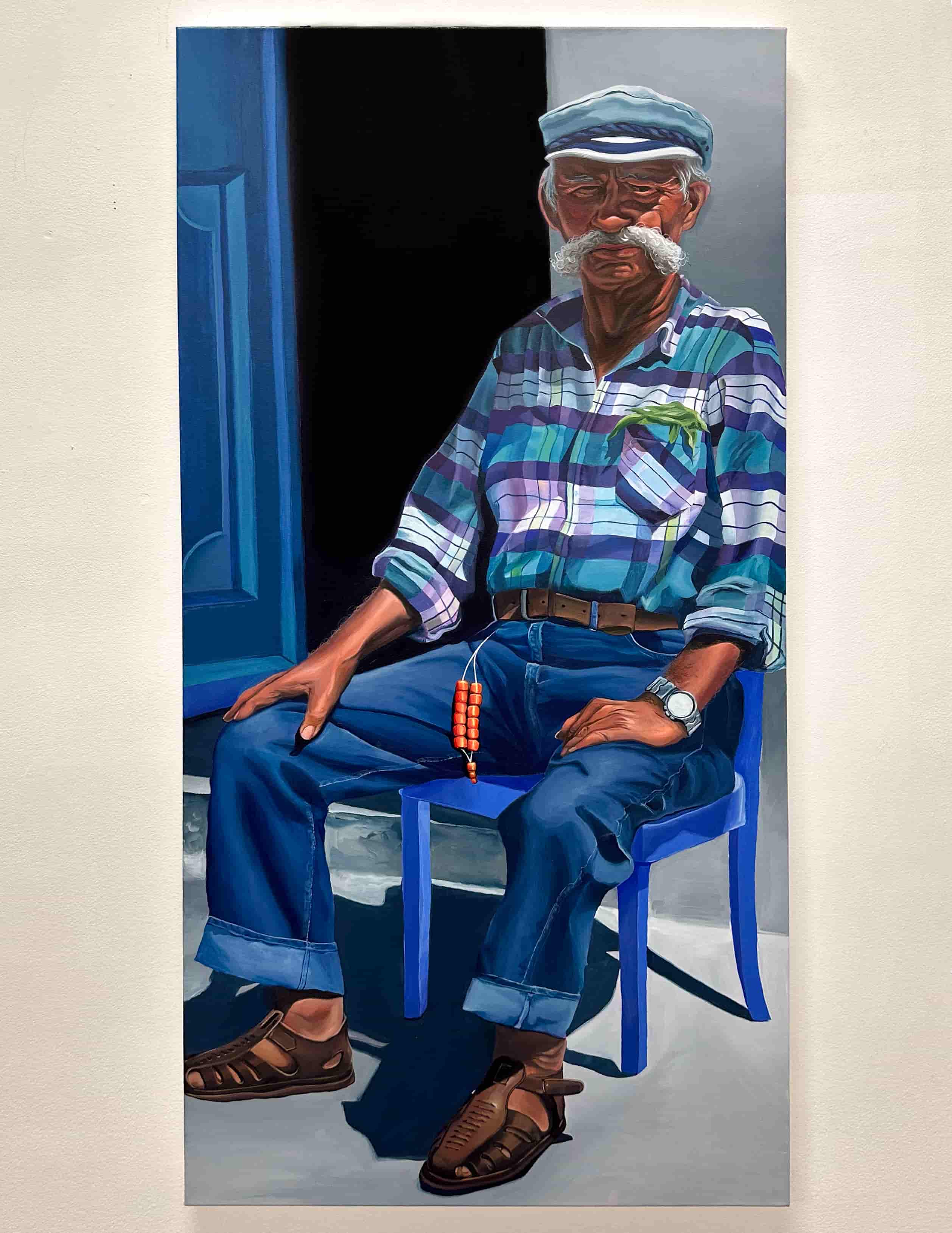 A portrait of an old man, a fisherman, sitting in front of a doorway.